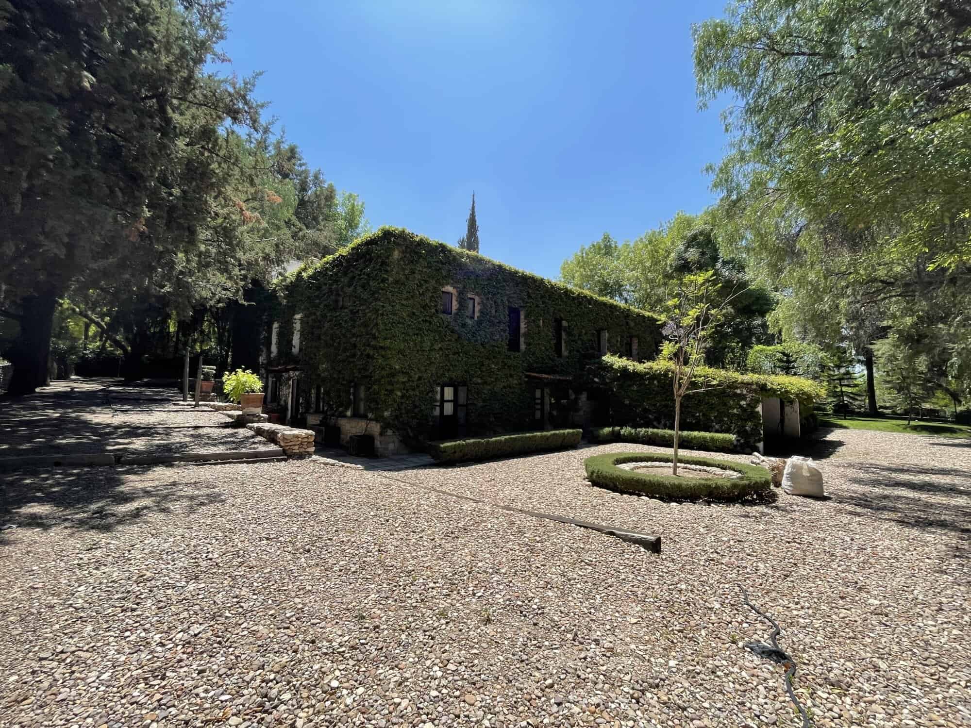 Luxury countryside villa with lush gardens and scenic views.
