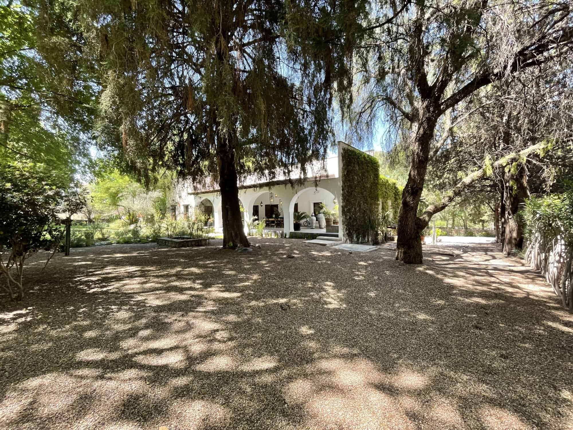 Elegant villa with spacious garden and mature trees.