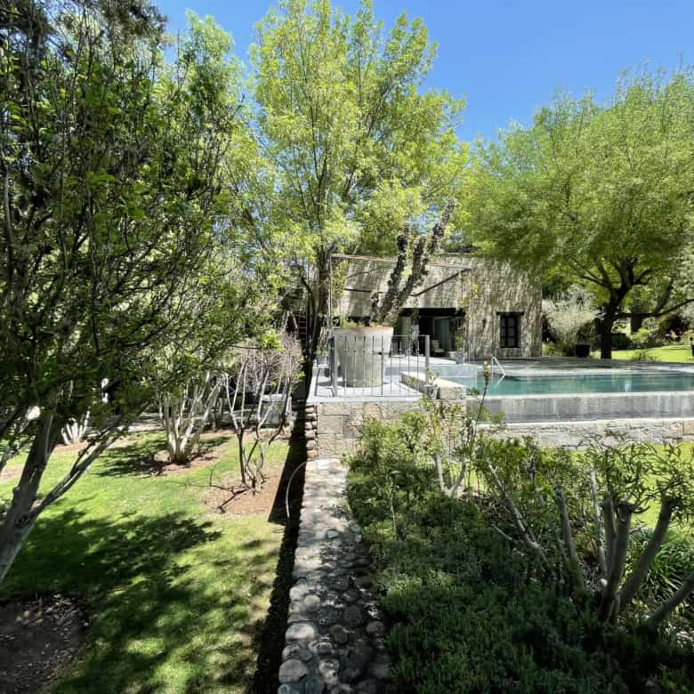 Luxury villa with pool and lush garden in Spain for sale.