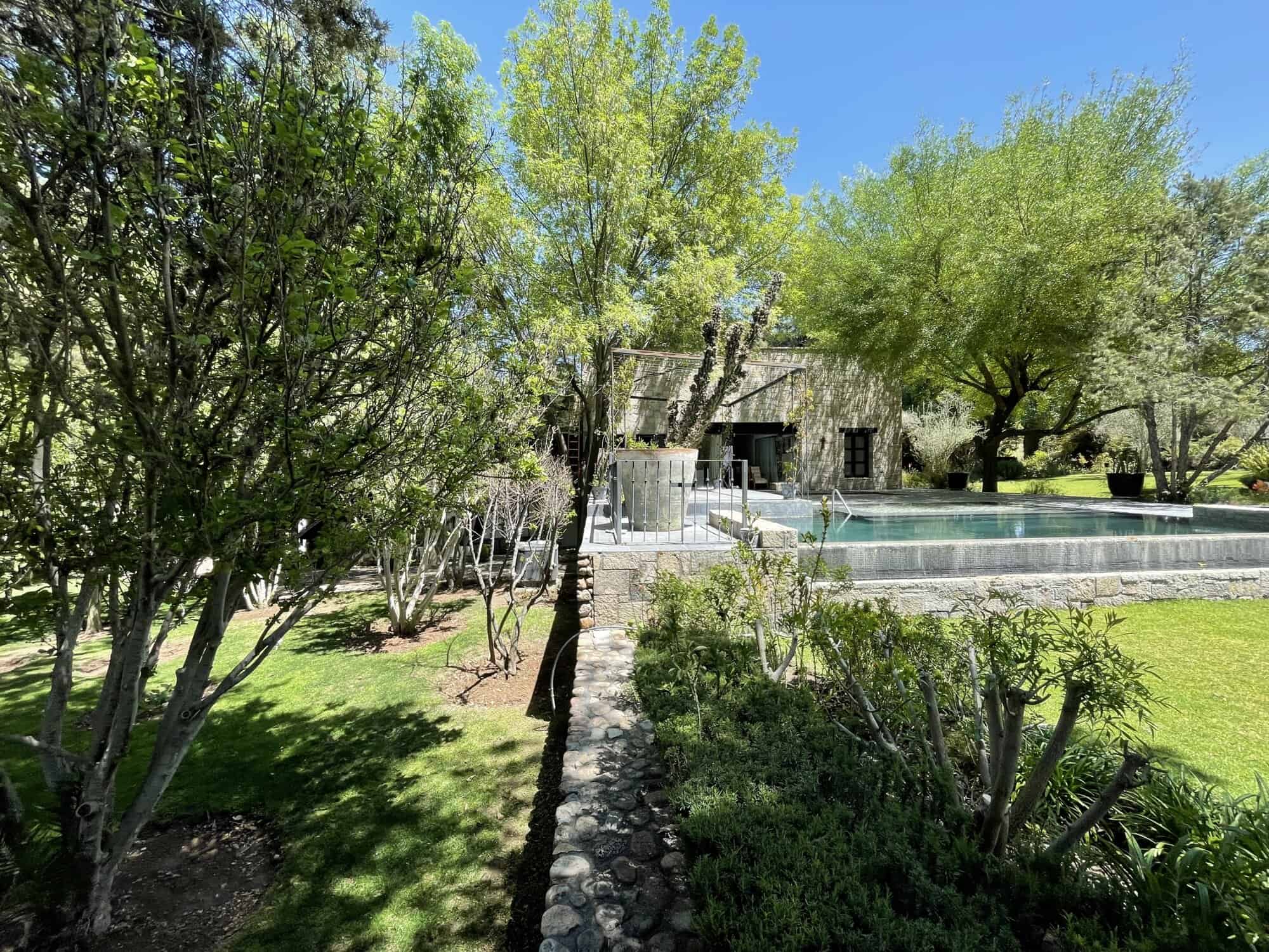 Luxury villa with pool and lush garden in Spain for sale.