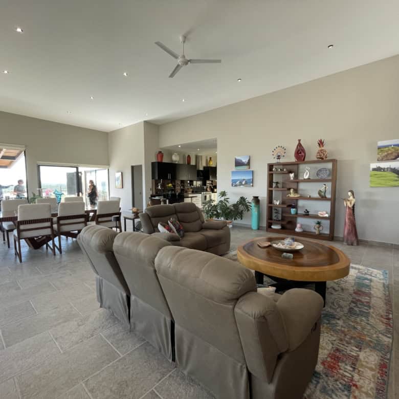 Bright and airy living room featuring comfortable seating and contemporary art. Perfect for relaxing.