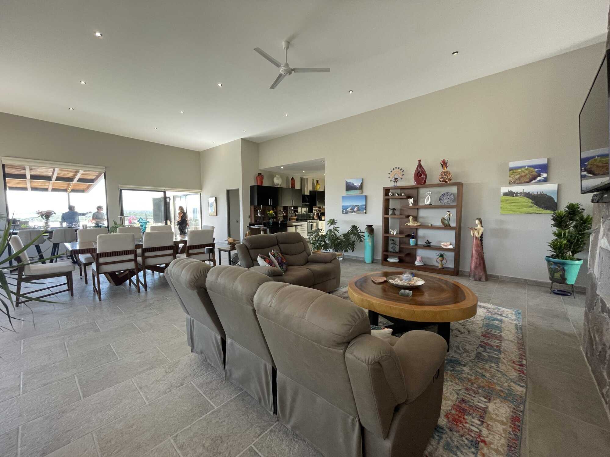 Bright and airy living room featuring comfortable seating and contemporary art. Perfect for relaxing.