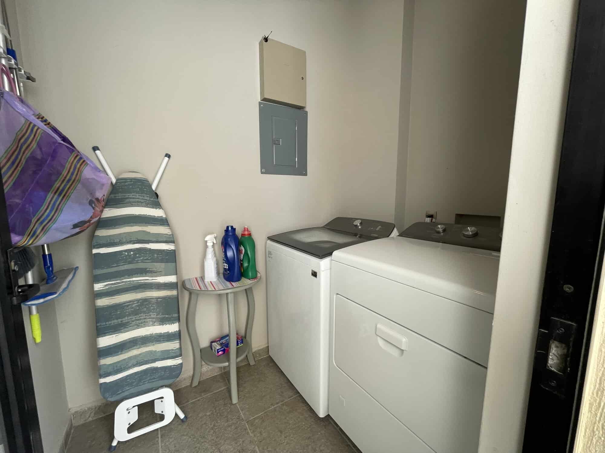 Laundry room featuring a washing machine and dryer setup for convenient household chores.