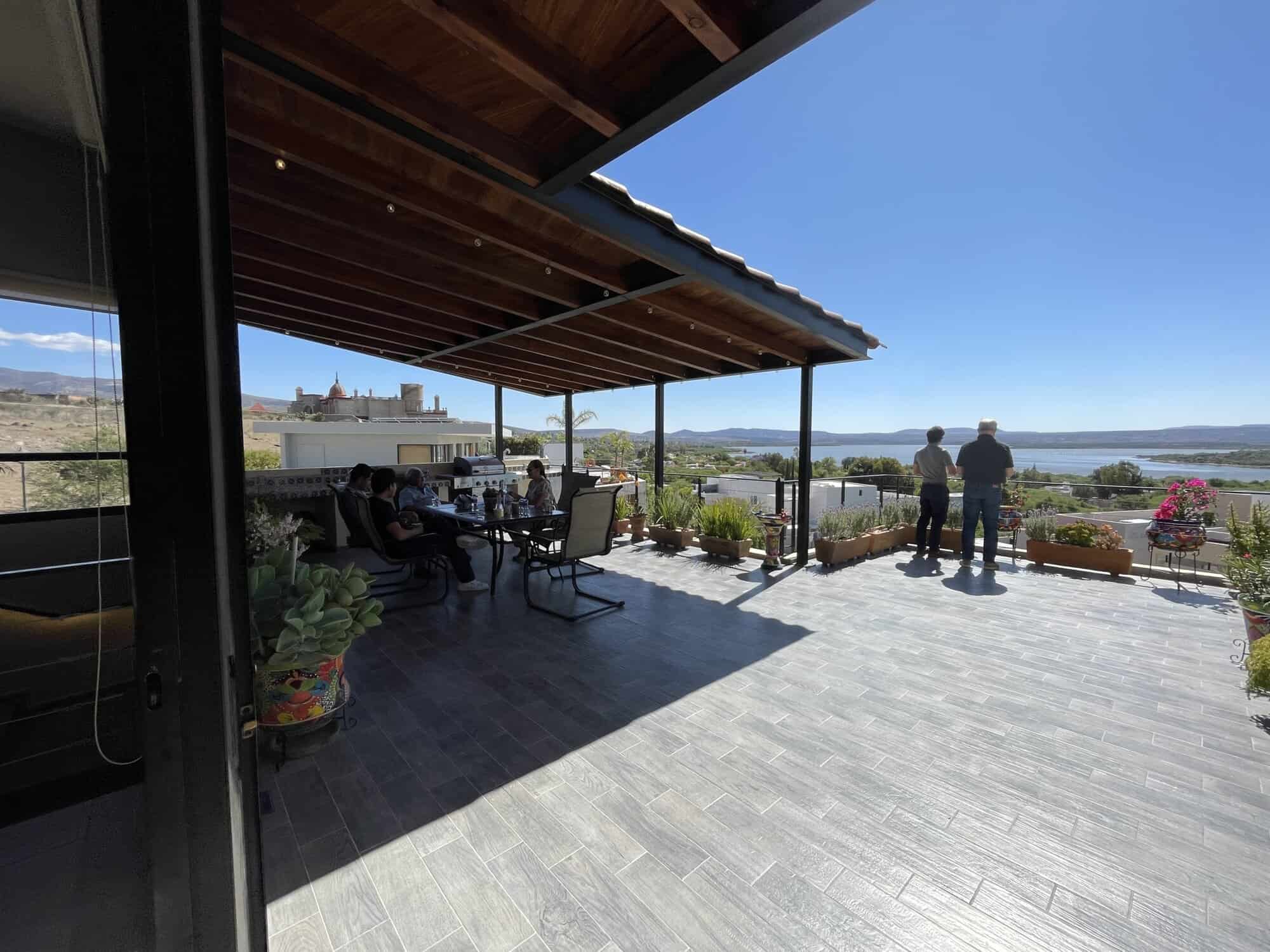 Outdoor terrace with water views and seating area.