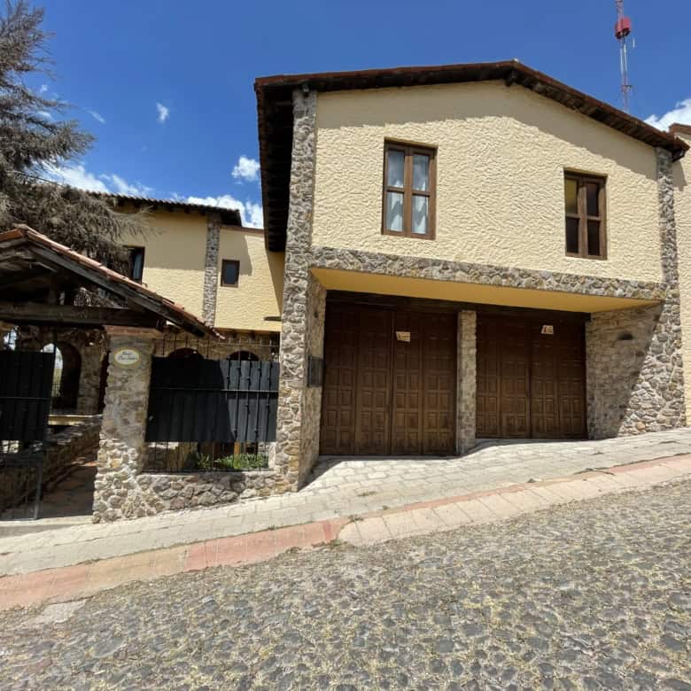 Beautiful two-story house with a spacious garage and rustic stone accents. Perfect for comfortable l.