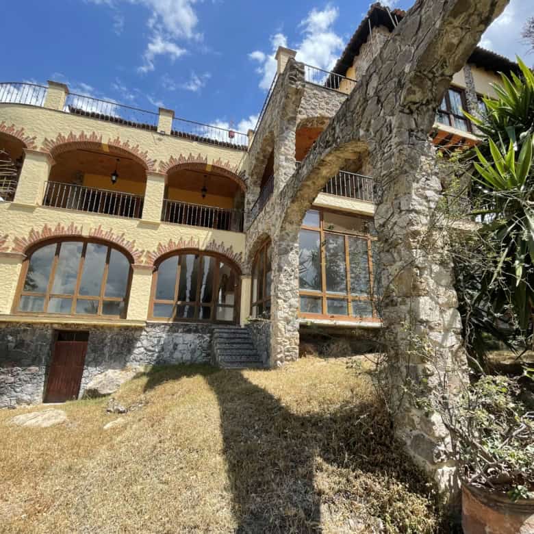 Luxury hillside villa with panoramic views of the surrounding landscape.