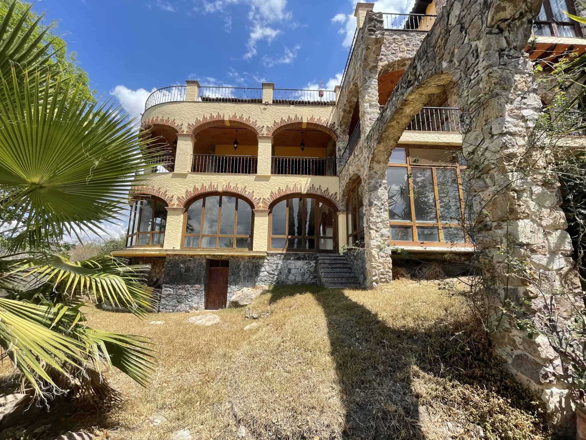 Seaside villa featuring panoramic ocean views, multiple terraces, and lush landscaping. Perfect for.