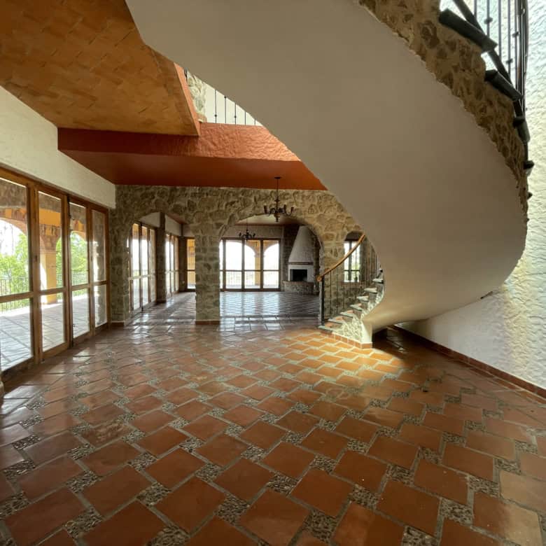 Bright interior showcasing stone pillars and wooden accents in a modern home.