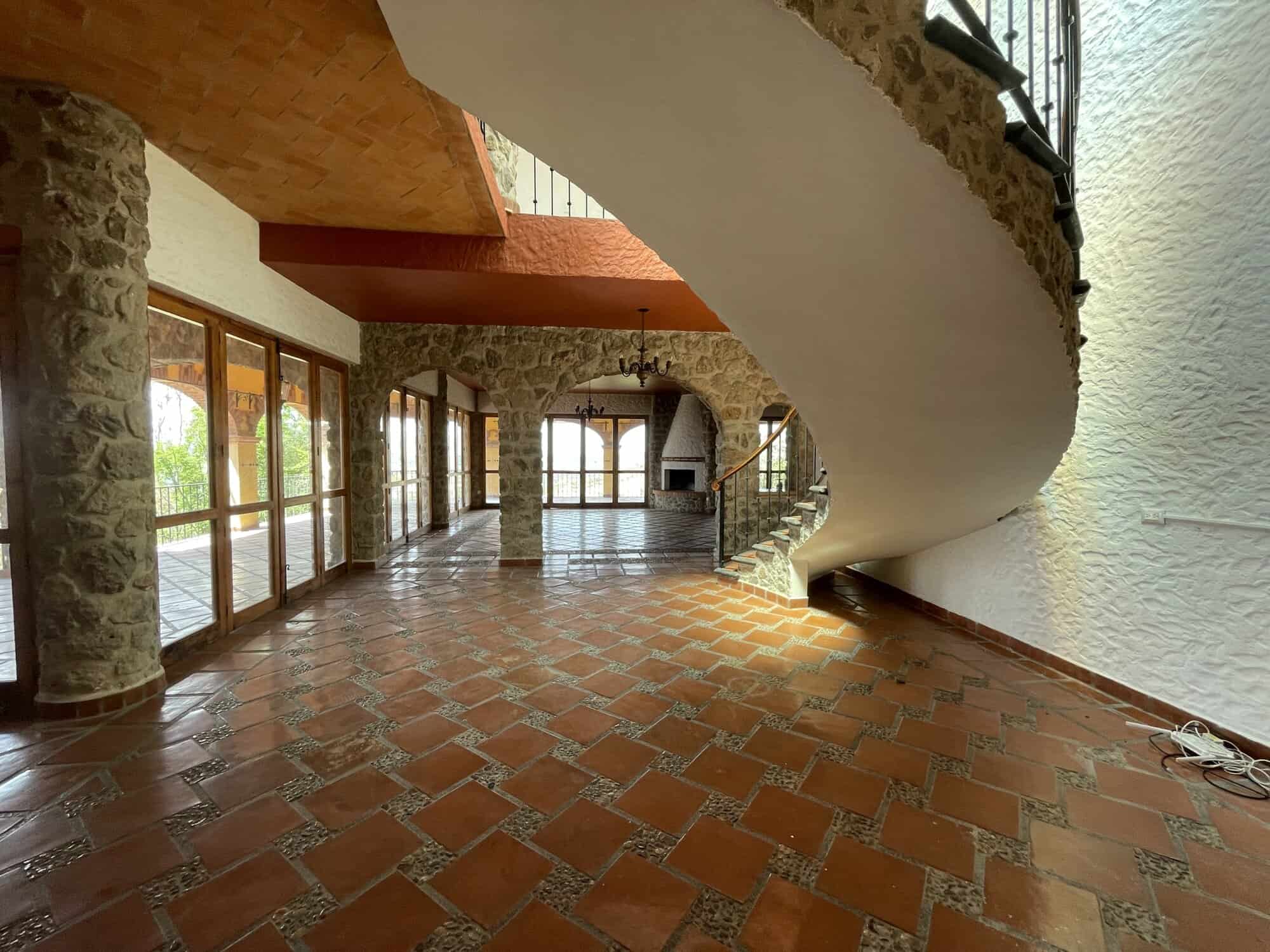 Bright interior showcasing stone pillars and wooden accents in a modern home.