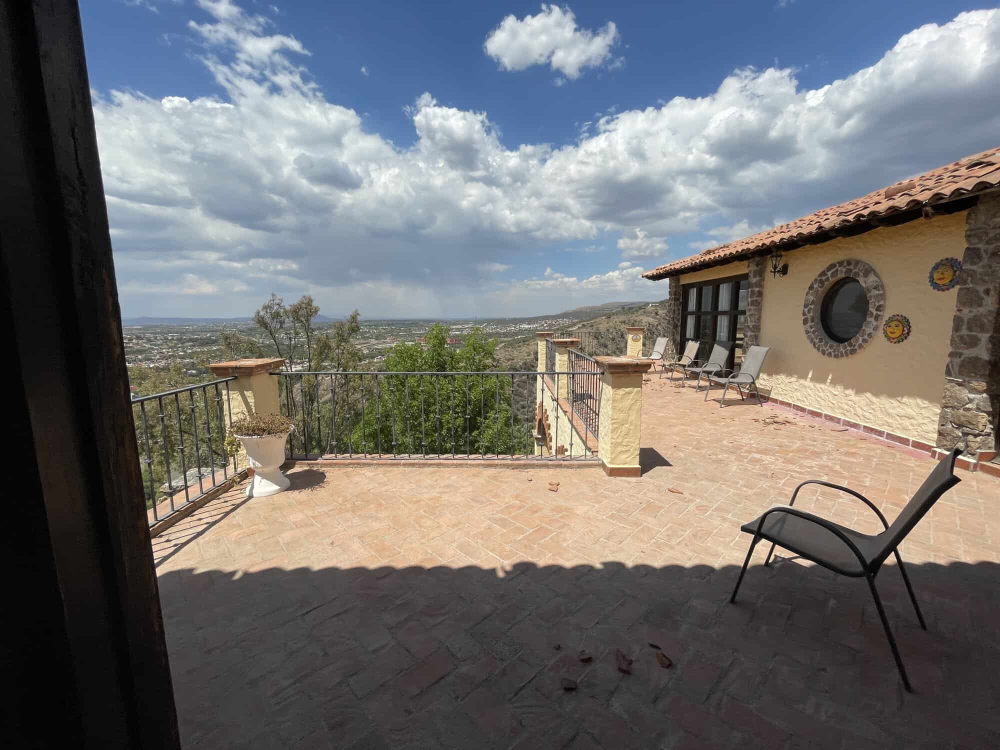 Luxury terrace with scenic city views and outdoor seating.