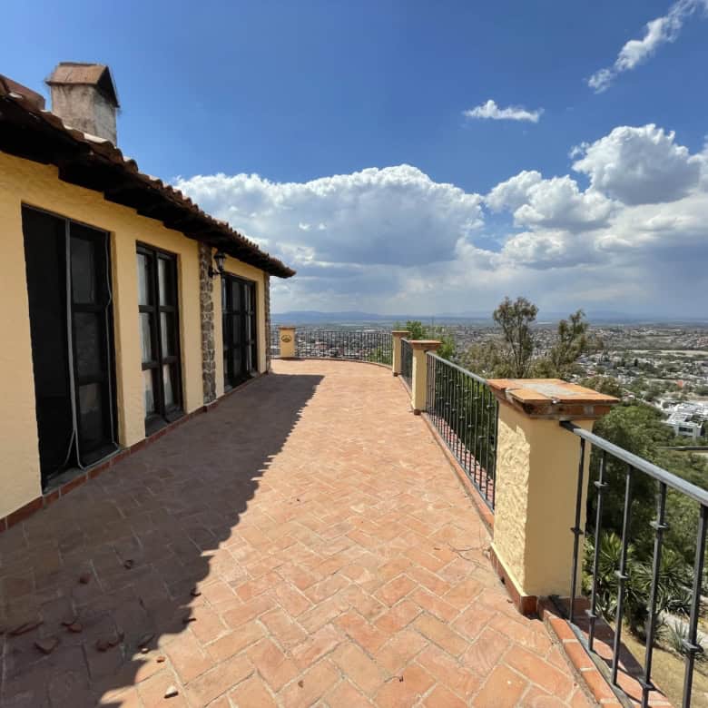 Terrace of a luxury villa overlooking the cityscape.