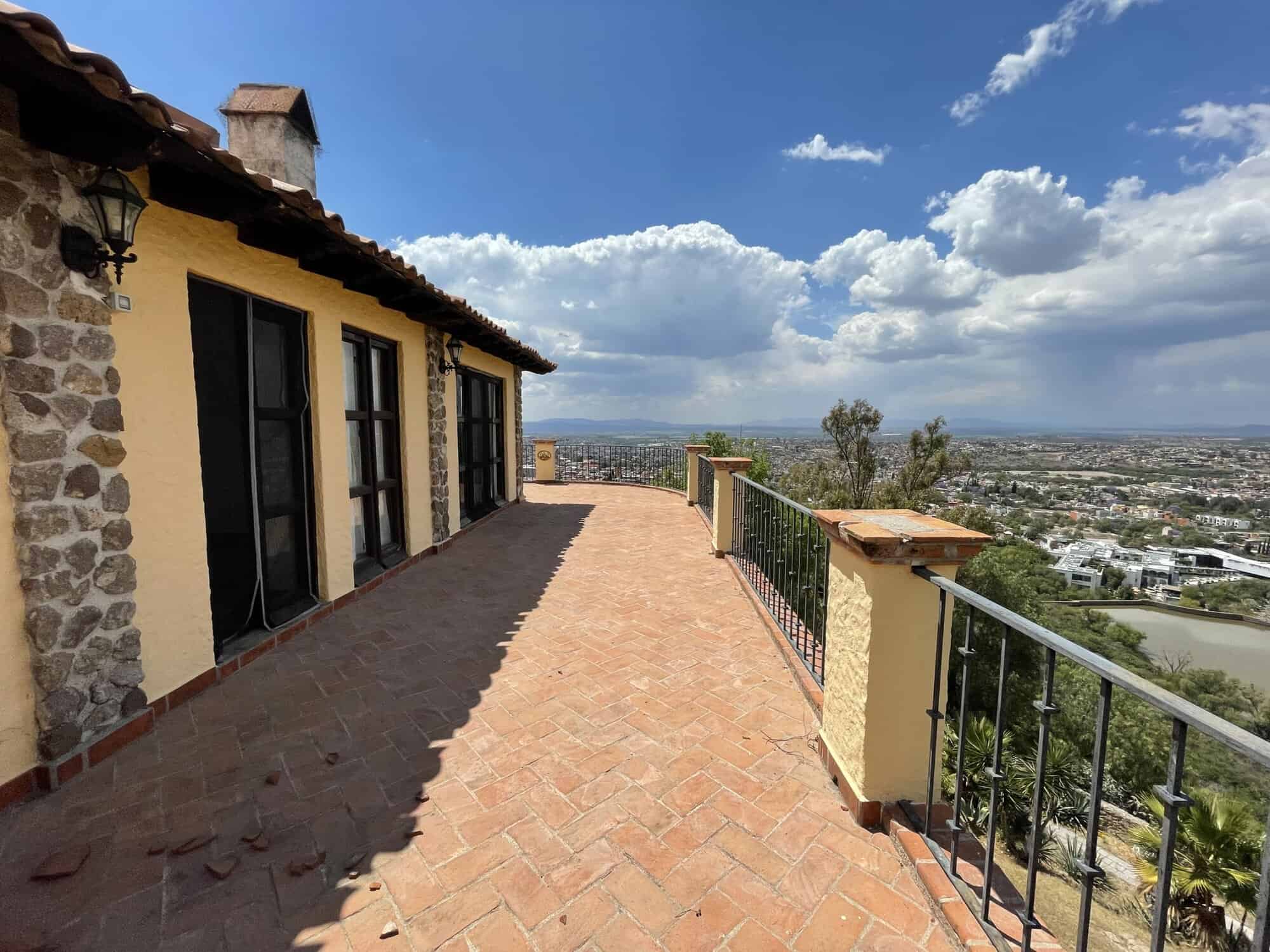 Terrace of a luxury villa overlooking the cityscape.