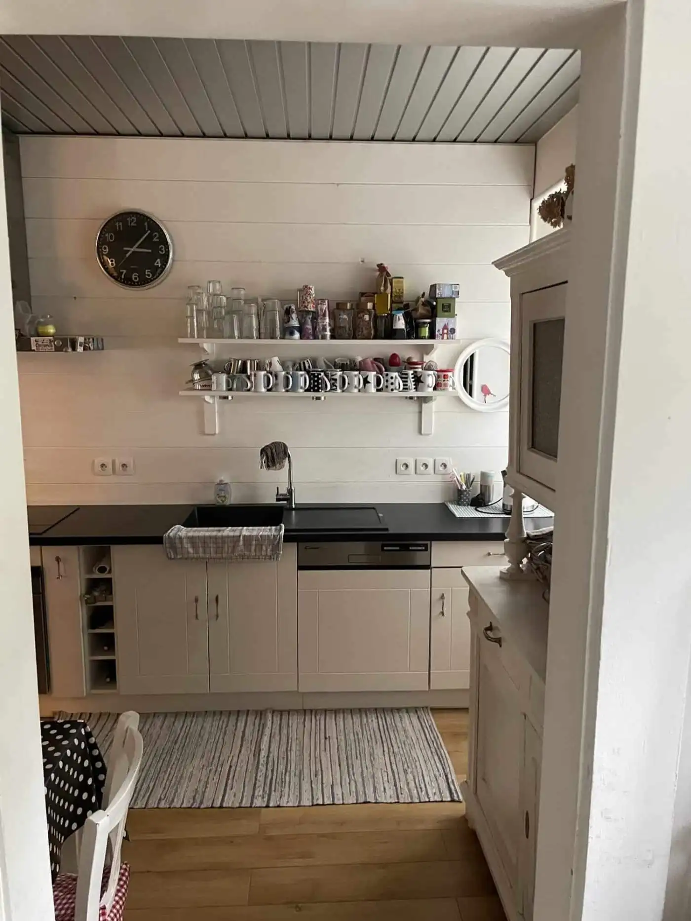 Cozy Kitchen in Altkirch France Bright kitchen with white cabinets and open shelving in Altkirch, France.
