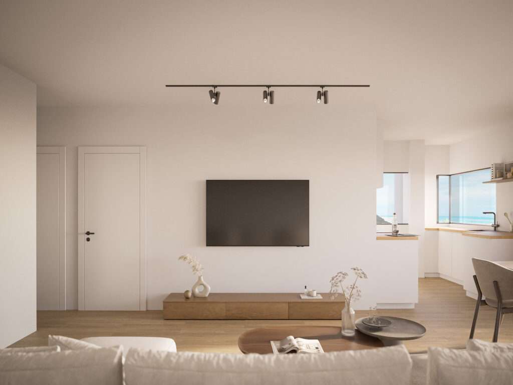 Bright living room with wall-mounted TV and natural light in Sao Bernardino, Portugal.