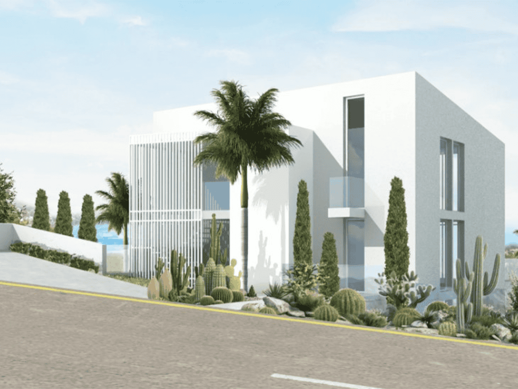 Contemporary white villa with palm trees near Chamolia Beach, Athens, Greece.