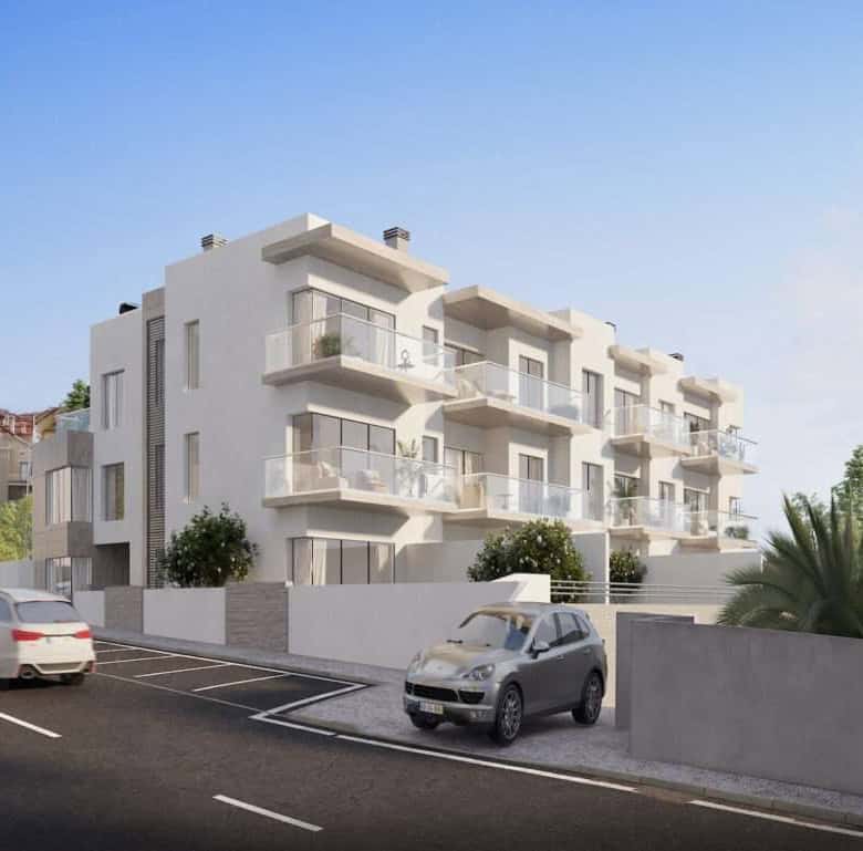 Modern apartment building in Sao Bernardino, Portugal with balconies and lush landscaping.