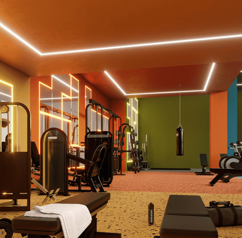 Brightly lit gym with modern exercise equipment and colorful walls in Barrio Escalante, San Jose, Co.
