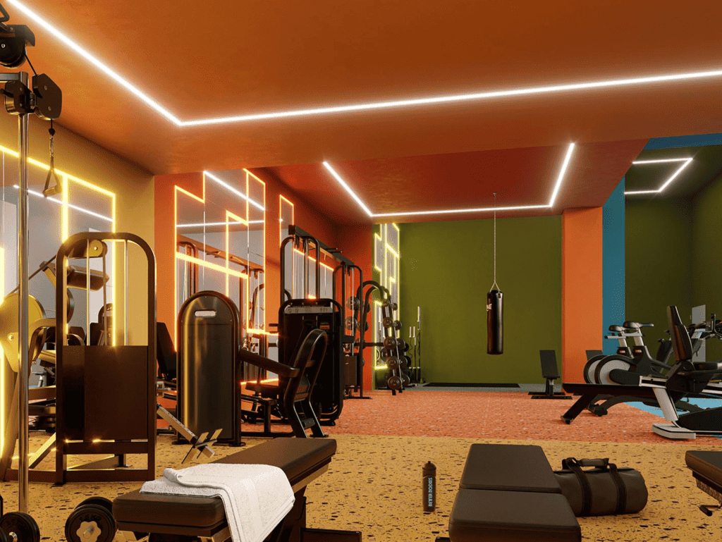 Brightly lit gym with modern exercise equipment and colorful walls in Barrio Escalante, San Jose, Co.