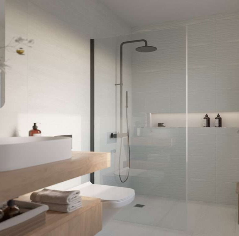 Contemporary bathroom featuring a walk-in shower, sleek fixtures, and natural light.