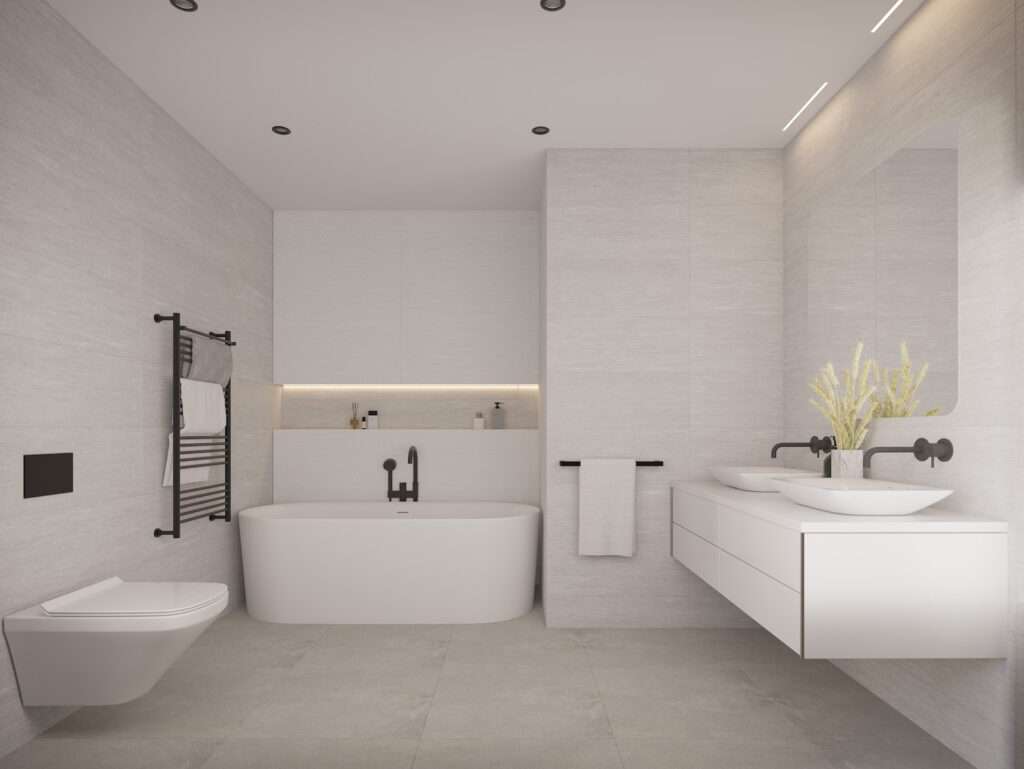 Contemporary bathroom featuring a bathtub, wall-mounted toilet, and stylish sink in a bright, modern.