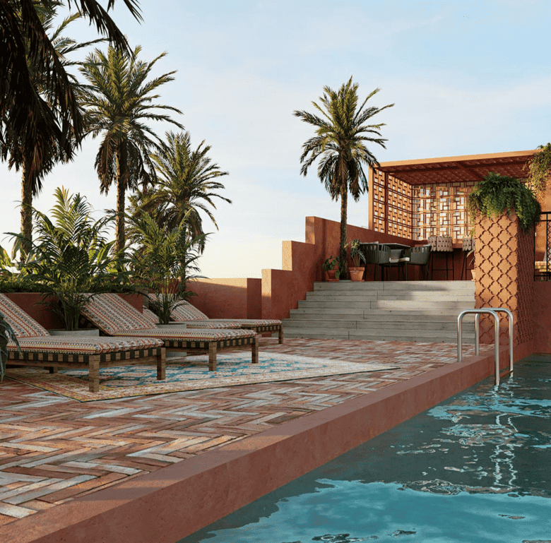 Relaxing pool area with sun loungers and tropical palm trees in Barrio Escalante, San Jose, Costa Ri.