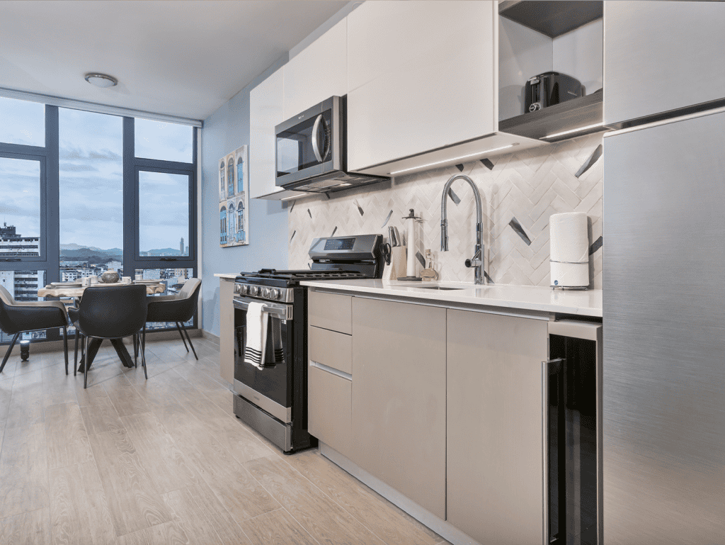 Modern kitchen with appliances and cityscape in Panama City, Panama.