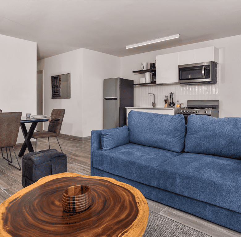 Modern Panama City apartment interior with open-plan living and kitchen area.