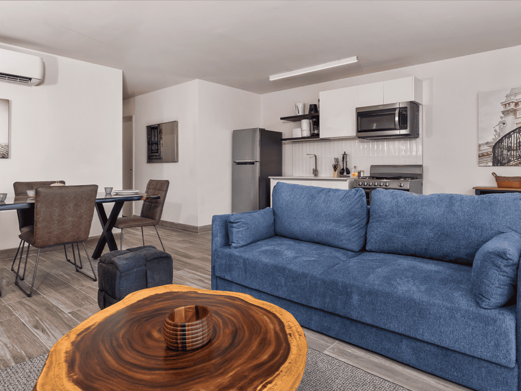 Modern Panama City apartment interior with open-plan living and kitchen area.