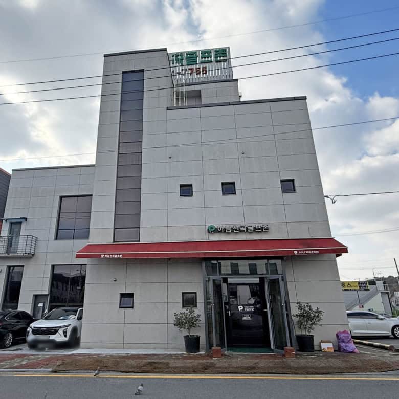 Modern commercial building with a sleek design, located in a busy business area.