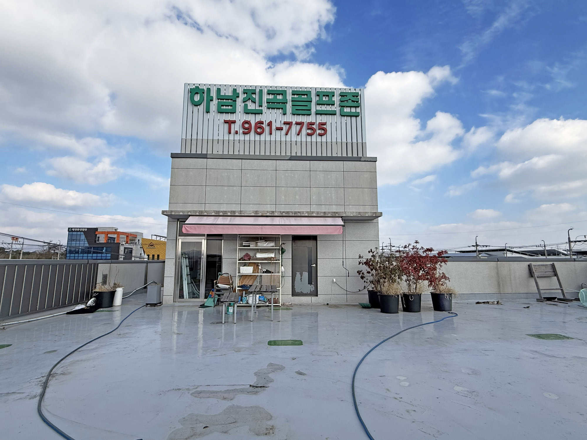 Affordable Korean property with rooftop view and commercial space.