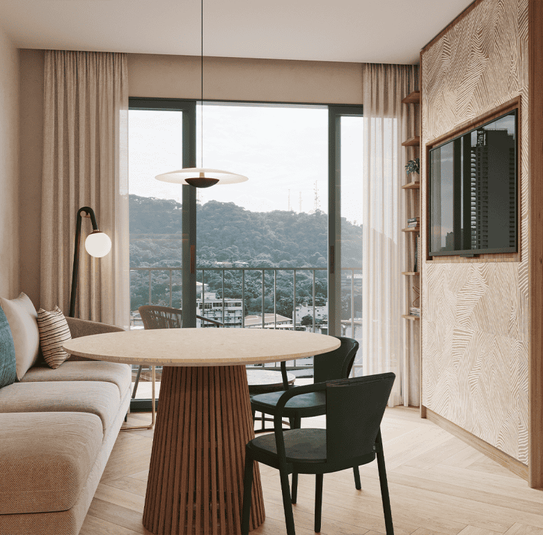 Bright and stylish living room in Panama City with large windows and mountain scenery.
