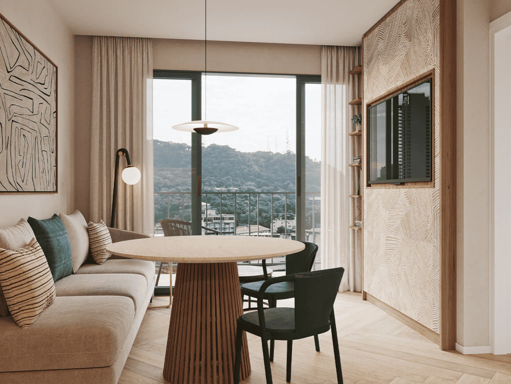 Bright and stylish living room in Panama City with large windows and mountain scenery.