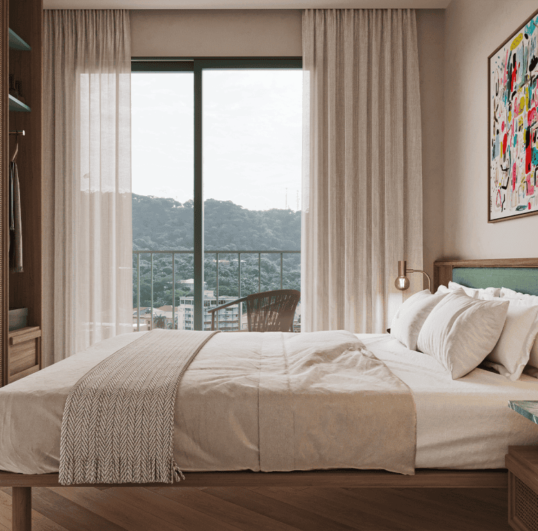 Bright bedroom with large window overlooking Panama City skyline and lush green hills.