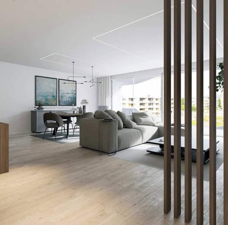 Spacious, bright living room with contemporary furniture and large windows in Viana do Castelo, Port.