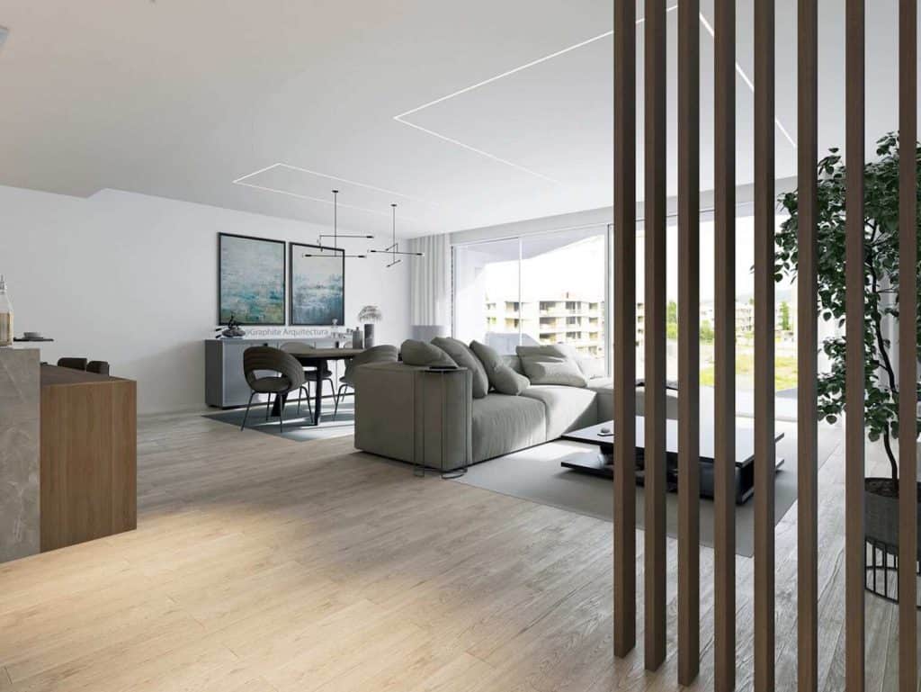 Spacious, bright living room with contemporary furniture and large windows in Viana do Castelo, Port.