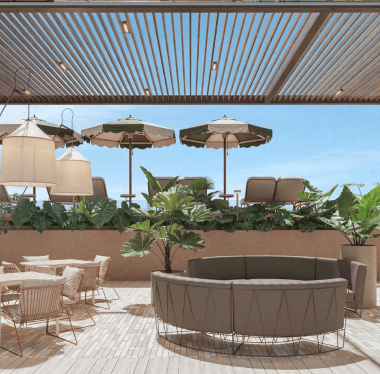 Outdoor terrace with comfortable seating, umbrellas, and lush plants in La Union, Panama City.