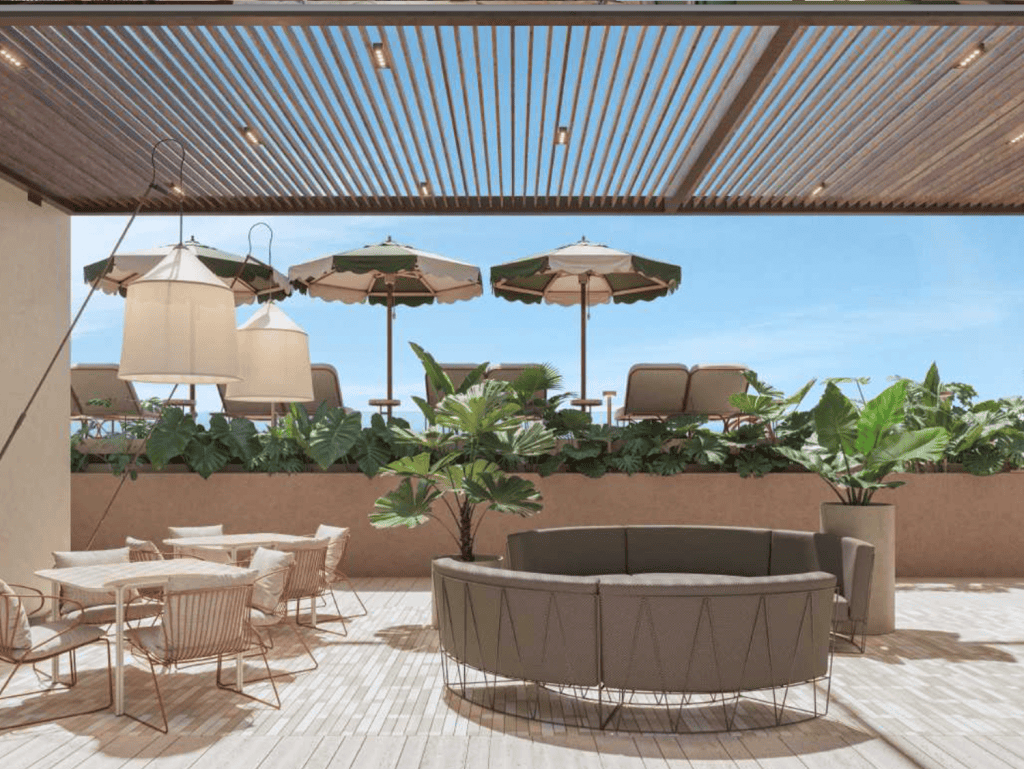 Outdoor terrace with comfortable seating, umbrellas, and lush plants in La Union, Panama City.
