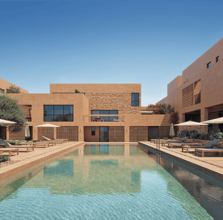 Modern Maleme Residences in Crete, Greece with pool and outdoor lounging areas.