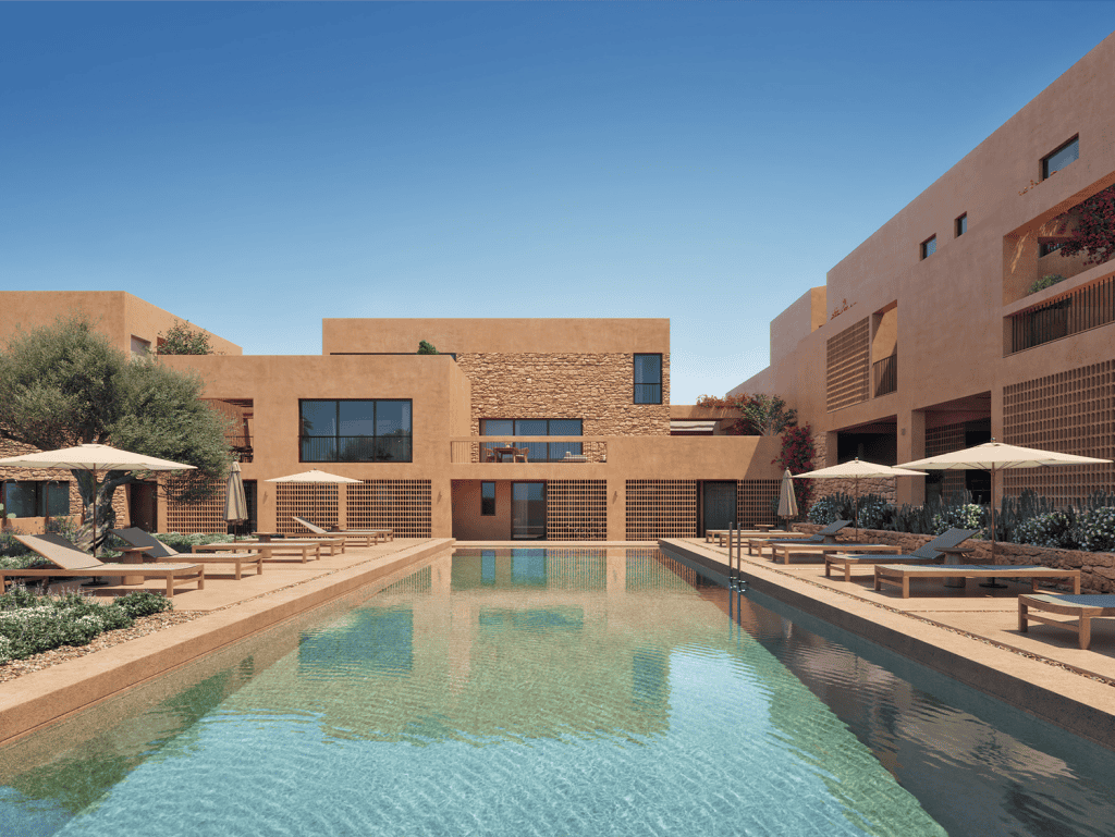 Modern Maleme Residences in Crete, Greece with pool and outdoor lounging areas.