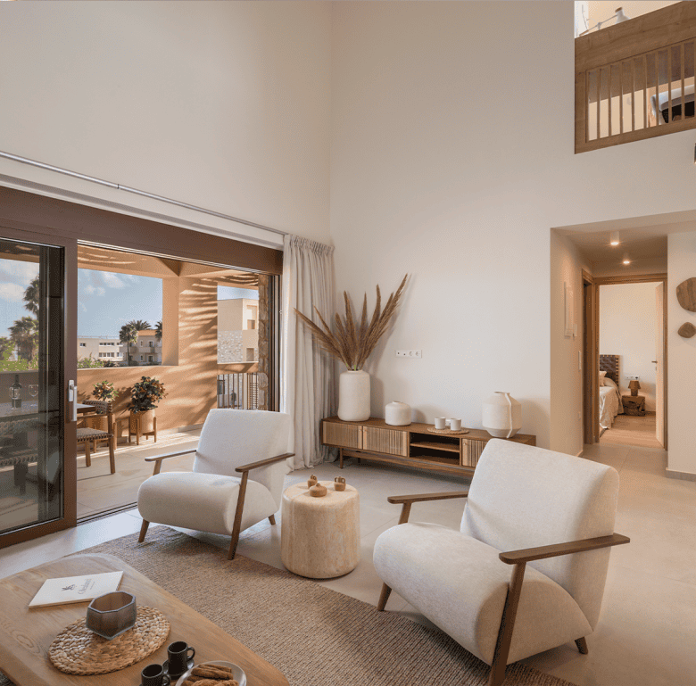 Modern living room in Maleme Residences, Crete, Greece, with bright natural light and stylish decor.