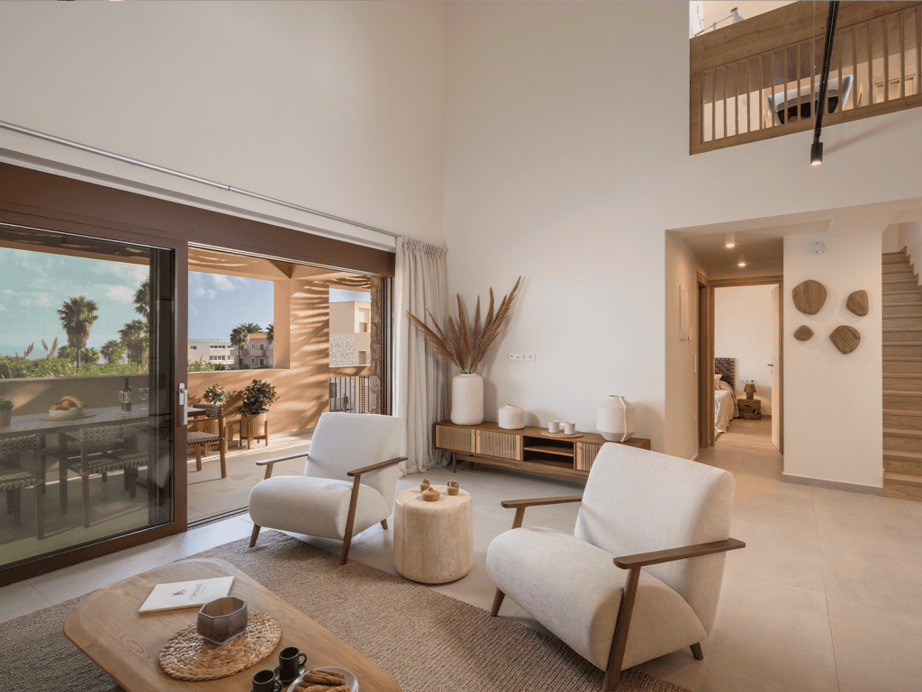 Modern living room in Maleme Residences, Crete, Greece, with bright natural light and stylish decor.