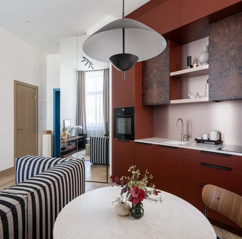 Contemporary Riga apartment kitchen with sleek cabinetry and open-plan living area.