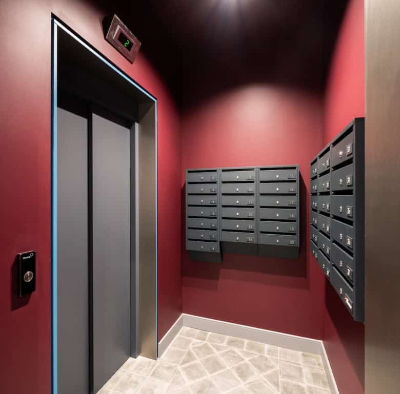 Elevator and mailbox area in a contemporary Riga apartment building.