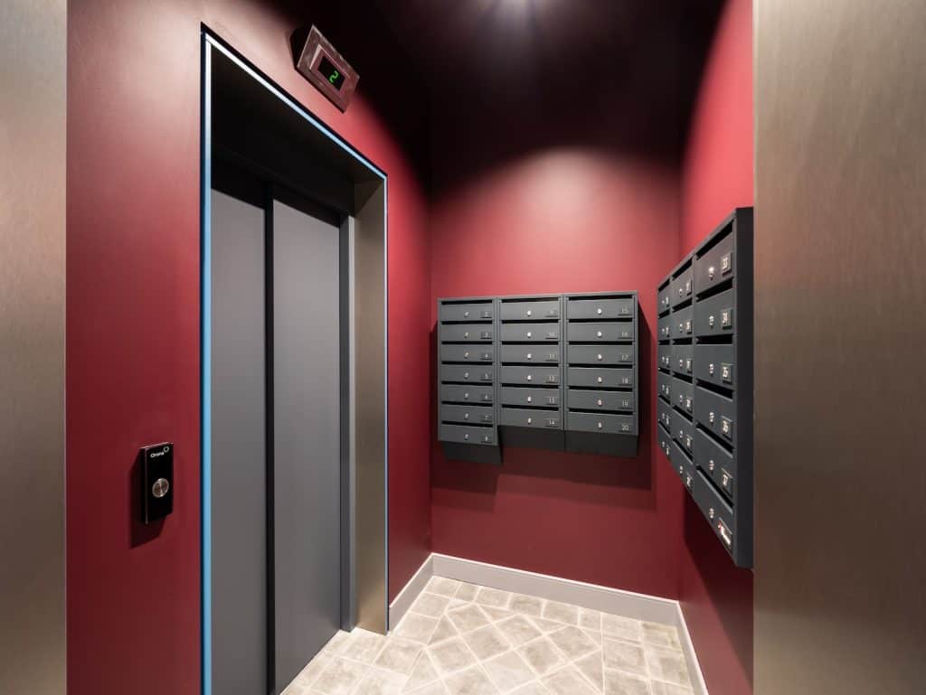 Elevator and mailbox area in a contemporary Riga apartment building.
