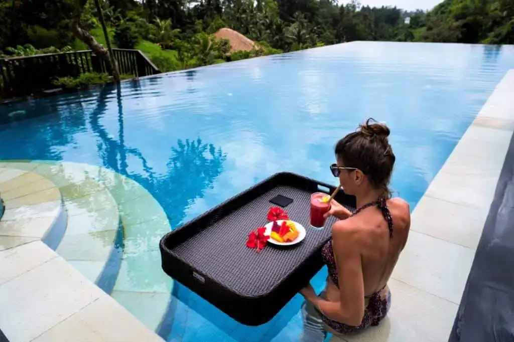 Luxury Bali Villa Pool Stunning infinity pool at Amori Villas in Ubud, Bali, with lush tropical surroundings.