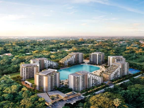 Lagoon view from luxury apartments in Asuncion, Paraguay, with modern buildings surrounding a centra.