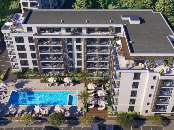 Bright Nessebar apartment with pool, balcony, and garden views.