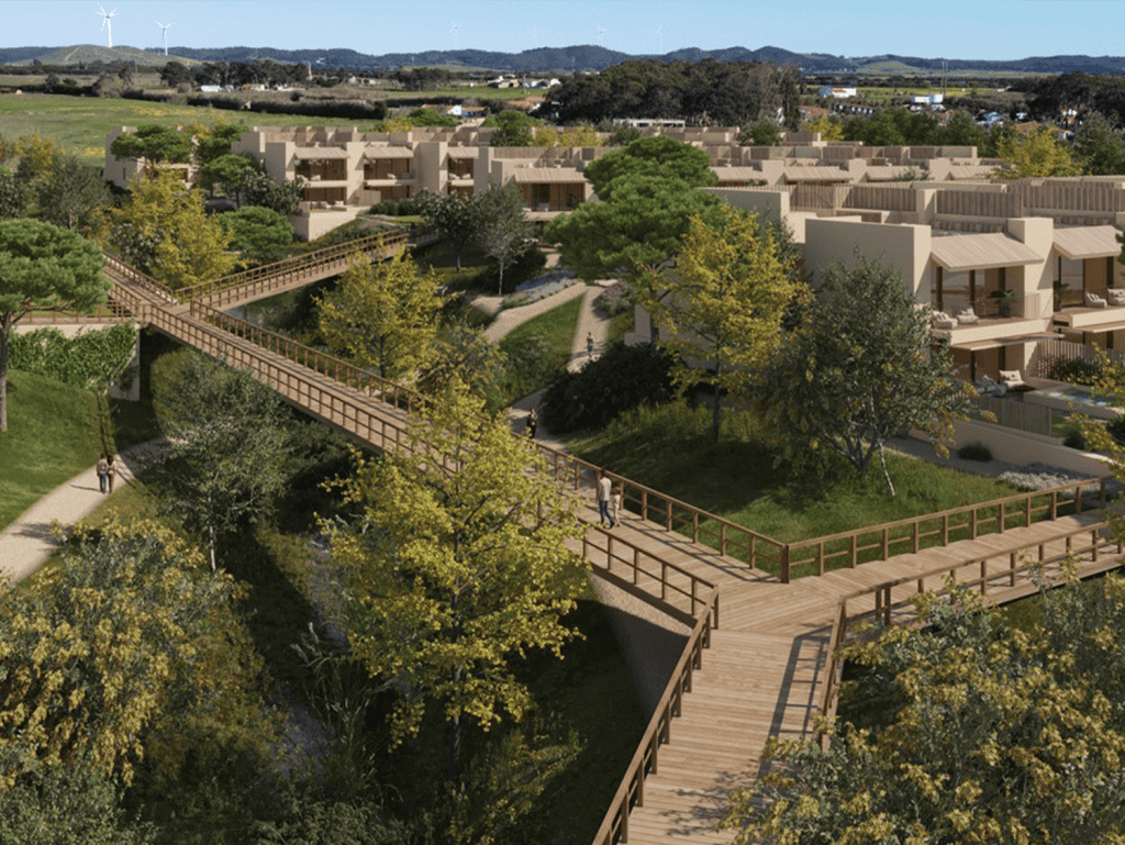 Scenic view of Porto Covo and Sines with lush greenery and modern homes in Portugal.