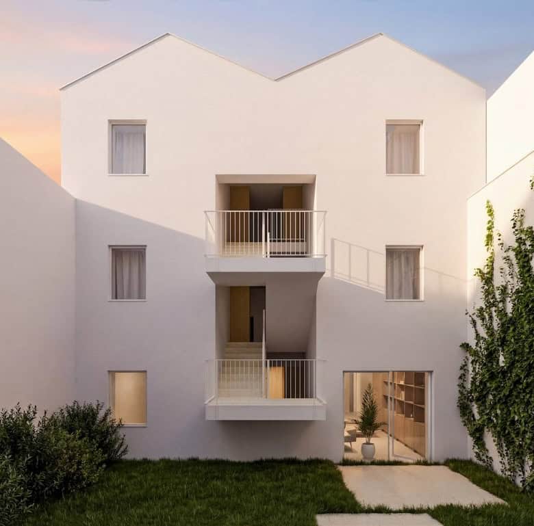 Contemporary white apartment building with balconies in Porto, Portugal.