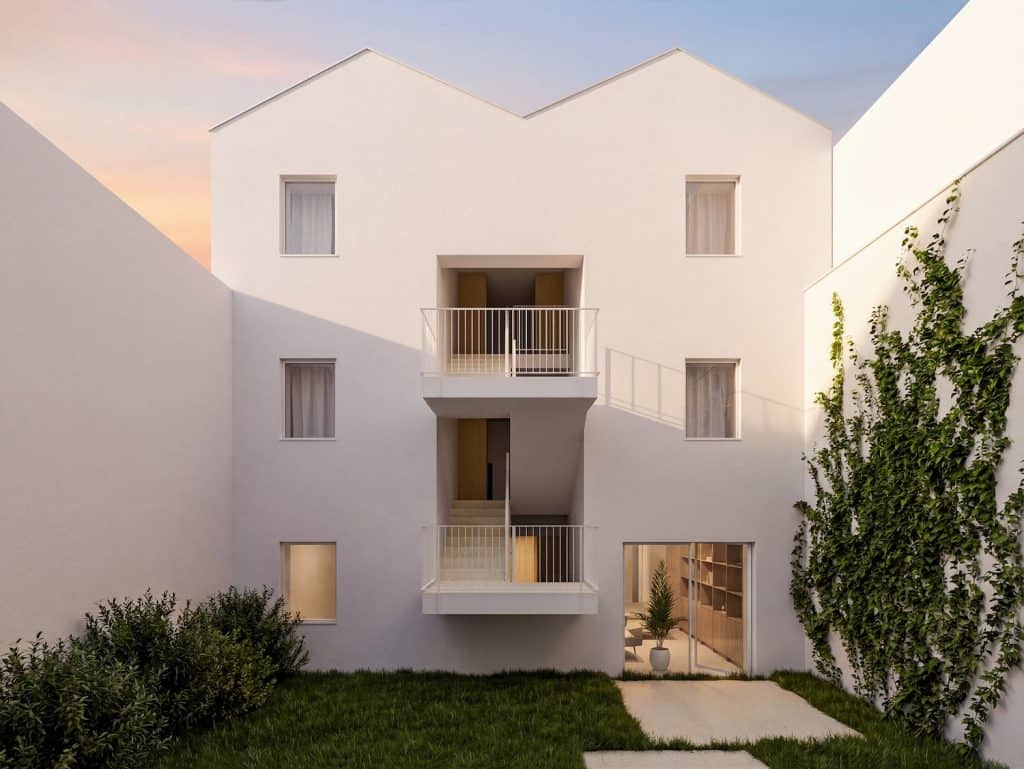 Contemporary white apartment building with balconies in Porto, Portugal.